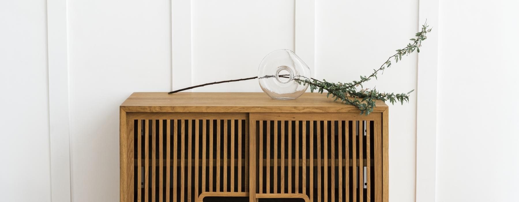 a plant on a cabinet